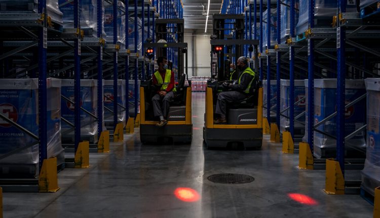 On Factory Floors, a Chime and Flashing Light to Maintain Distance