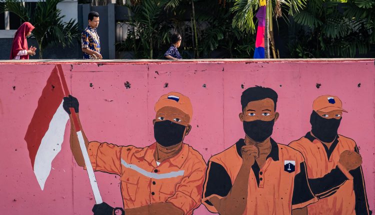 Indonesia will take at least a year to reach Covid 'herd immunity': Minister