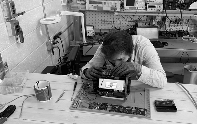 The H3x lab with someone working on a motor the size of a toaster.